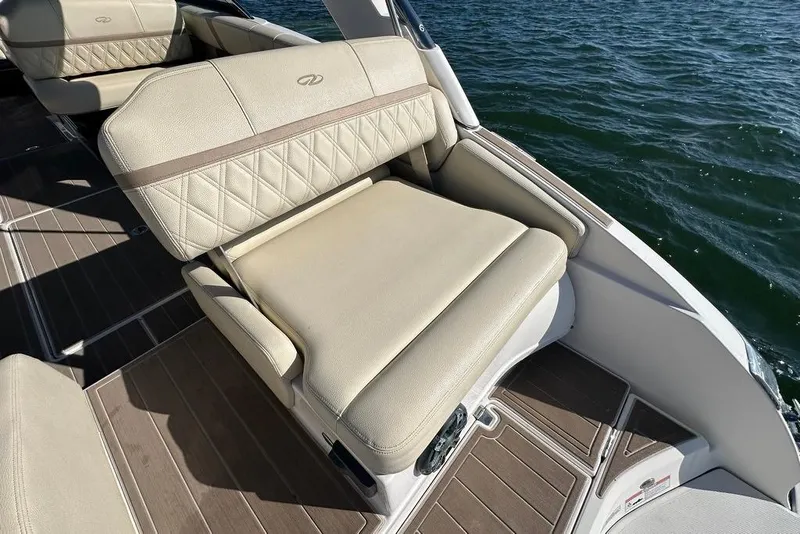 Slide: The Image of Luxurious seating on 2019 Regal 29 OBX boat with water view. - 31