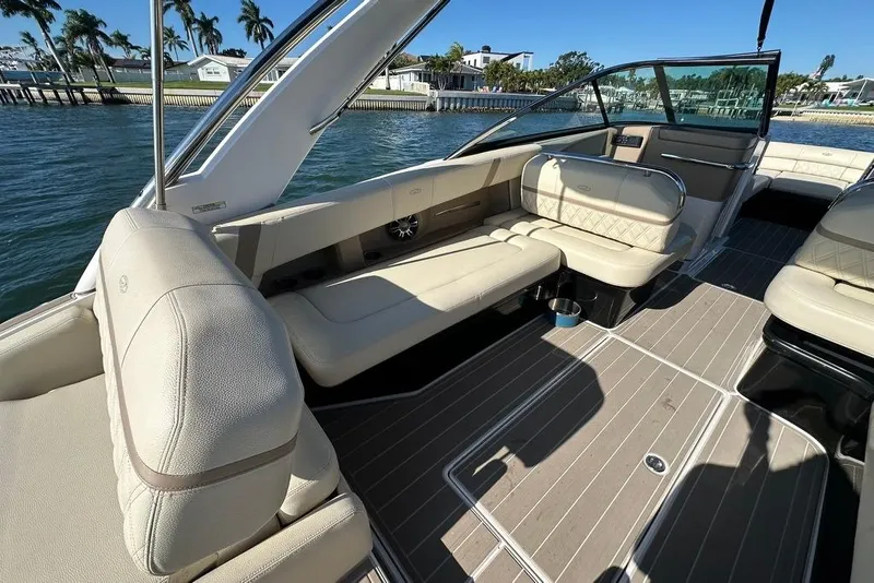 Slide: The Image of Luxurious interior of 2019 Regal 29 OBX boat with beige seating and sleek design. - 33