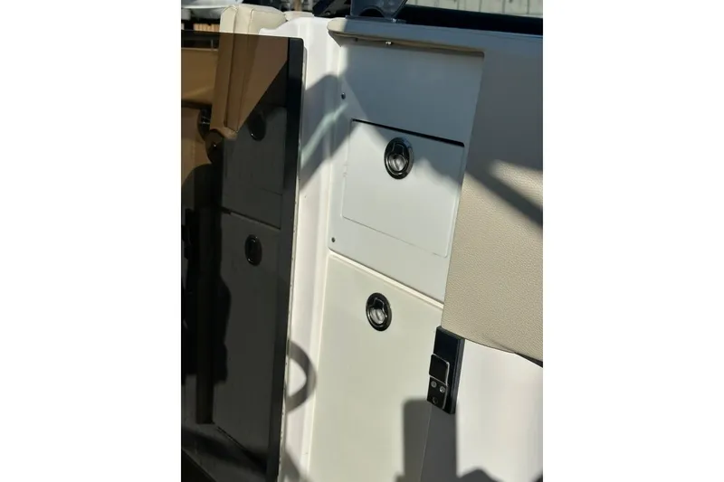 Slide: The Image of 2019 Regal 29 OBX boat interior storage compartments with sleek design. - 50