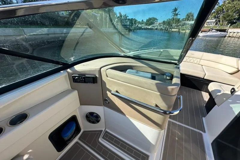 Slide: The Image of Interior view of 2019 Regal 29 OBX boat, featuring seating and control panel. - 52