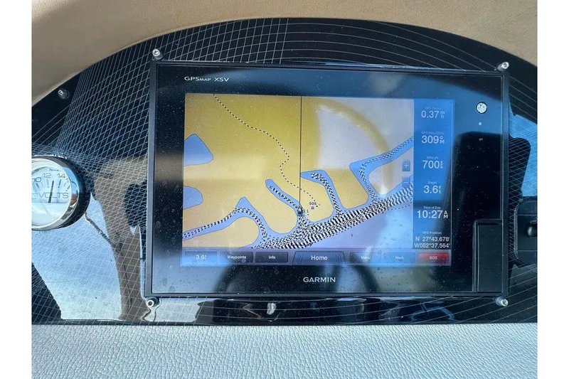 Slide: The Image of Garmin GPS display on 2019 Regal 29 OBX boat dashboard, showing navigation map and data. - 57