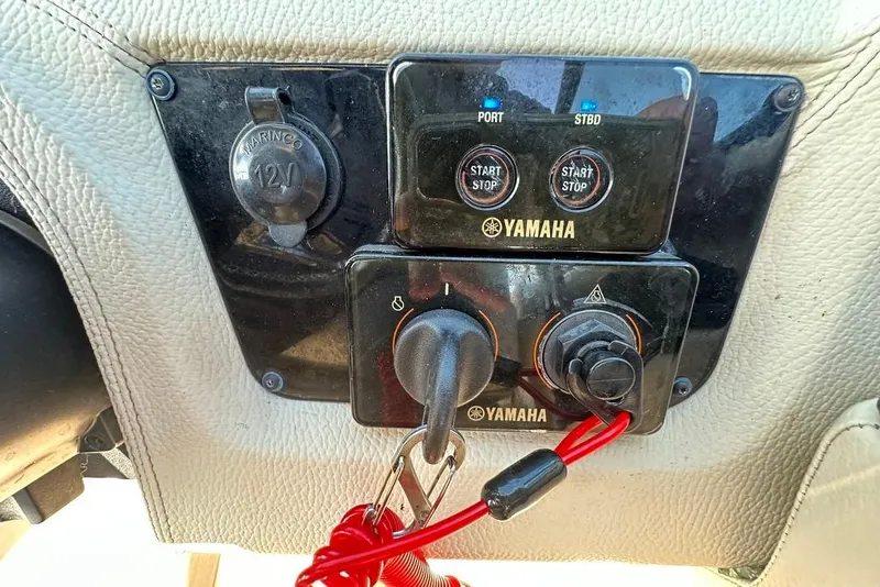 Slide: The Image of Control panel of a 2019 Regal 29 OBX boat with Yamaha start-stop buttons. - 59