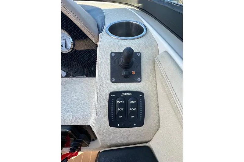Slide: The Image of Control panel of 2019 Regal 29 OBX boat with joystick and trim tabs. - 60