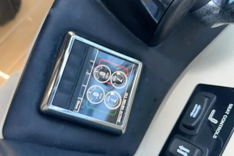 Slide: The Image of Control panel of a 2019 Regal 29 OBX boat with seat adjustment buttons. - 62