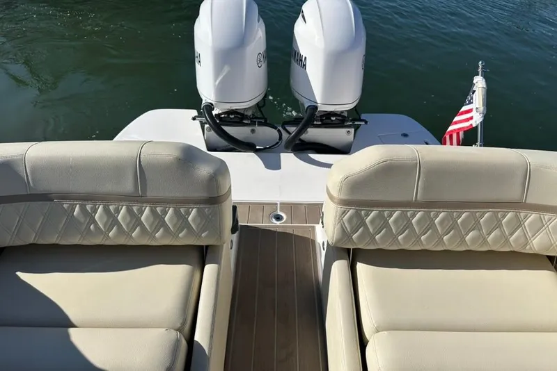 Slide: The Image of 2019 Regal 29 OBX boat with twin Yamaha engines and luxurious seating. - 66