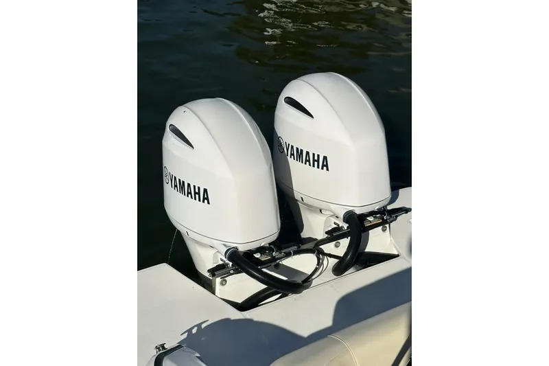Slide: The Image of 2019 Regal 29 OBX with dual Yamaha outboard motors on water. - 69