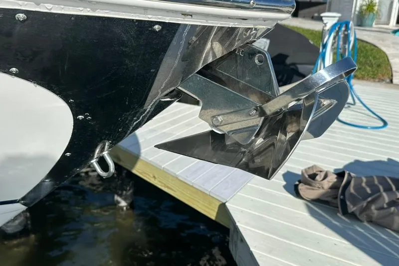 Slide: The Image of 2019 Regal 29 OBX boat anchor detail near dock. - 73