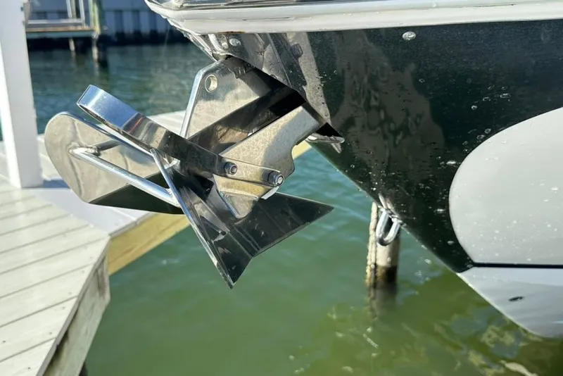 Slide: The Image of 2019 Regal 29 OBX boat anchor detail near dock. - 74