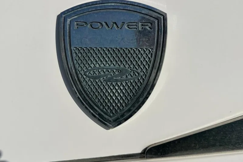 Slide: The Image of Emblem of 2019 Regal 29 OBX boat on white surface. - 76