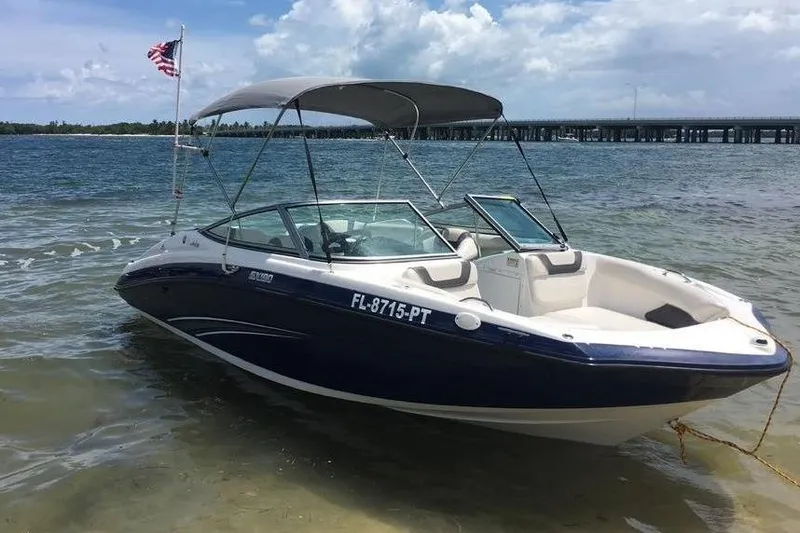 The Image of 2014 Yamaha SX190 boat on beach with bridge in background. - 5