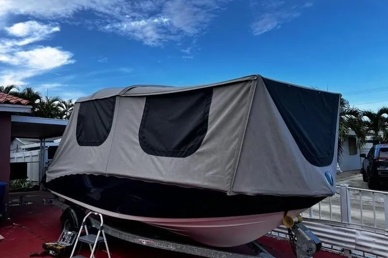 Slide: The Image of 2014 Yamaha SX190 boat with cover on trailer. - 9