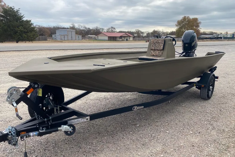 Slide: The Image of 2026 G3 Gator Tough 18 CC boat on trailer, parked outdoors. - 3