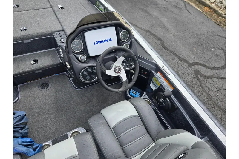 Slide: The Image of 2014 Triton 19XS boat cockpit with Lowrance display and steering wheel. - 13