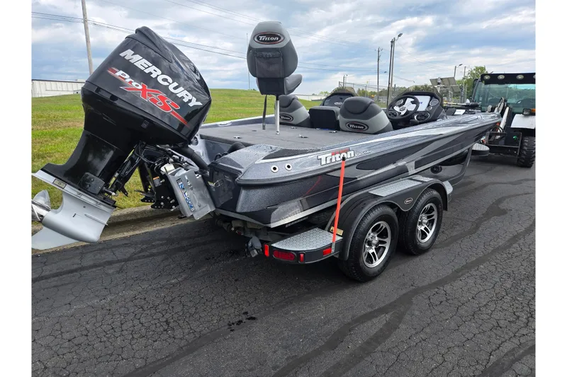 Slide: The Image of 2014 Triton 19XS boat with Mercury Pro XS engine on a trailer. - 3