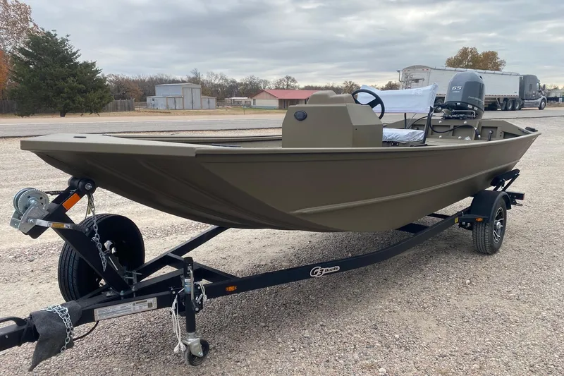 Slide: The Image of 2026 G3 Gator Tough 17 CCJ boat on trailer, parked outdoors. - 2