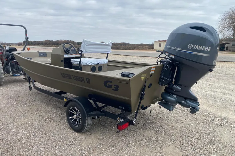 Slide: The Image of 2026 G3 Gator Tough 17 CCJ boat with Yamaha engine on a trailer. - 3