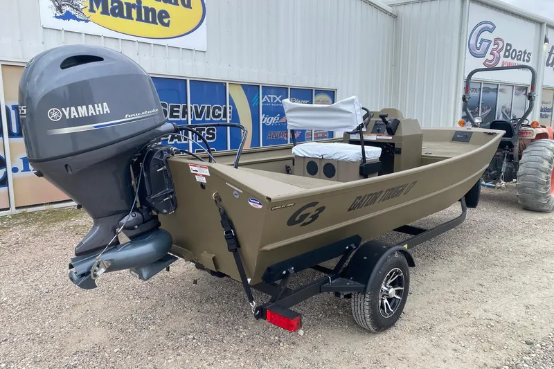 Slide: The Image of 2026 G3 Gator Tough 17 CCJ boat with Yamaha engine, displayed outdoors. - 5