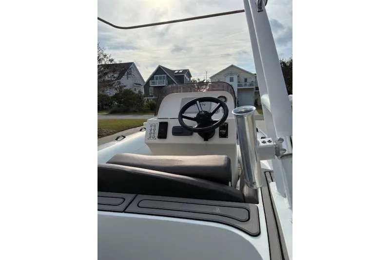 Slide: The Image of 2021 Highfield Sport 520 boat interior with steering wheel and control panel. - 3