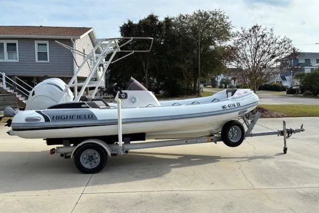 Slide: The Image of 2021 Highfield Sport 520 boat on trailer in residential driveway. - 7