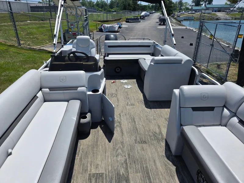 Slide: The Image of 2021 Godfrey SWEETWATER 2286 SFL pontoon boat interior with spacious seating and steering console. - 11