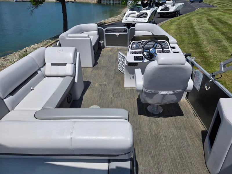 Slide: The Image of 2021 Godfrey SWEETWATER 2286 SFL pontoon boat interior with seating and steering console. - 18