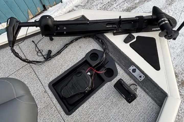 Slide: The Image of 2023 Tracker Pro Team 195 TXW Tournament Edition boat deck with trolling motor and controls. - 10