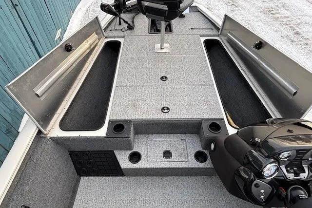 Slide: The Image of 2023 Tracker Pro Team 195 TXW Tournament Edition boat interior with storage compartments. - 11