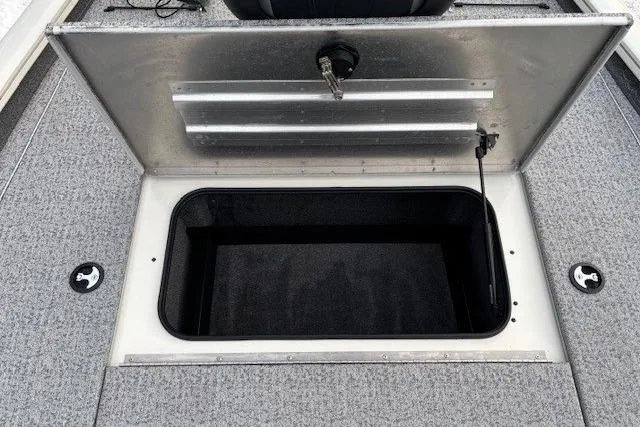 Slide: The Image of 2023 Tracker Pro Team 195 TXW Tournament Edition boat storage compartment open. - 13