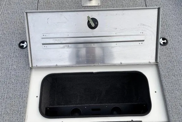 Slide: The Image of Open storage compartment on 2023 Tracker Pro Team 195 TXW Tournament Edition boat. - 14