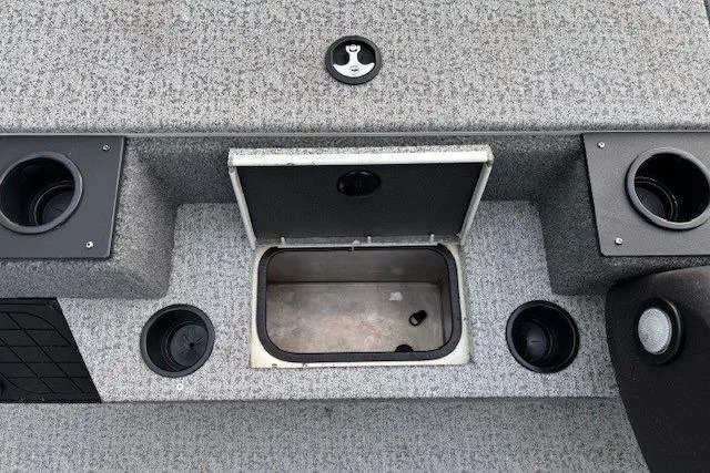Slide: The Image of 2023 Tracker Pro Team 195 TXW Tournament Edition boat storage compartment with cup holders. - 15
