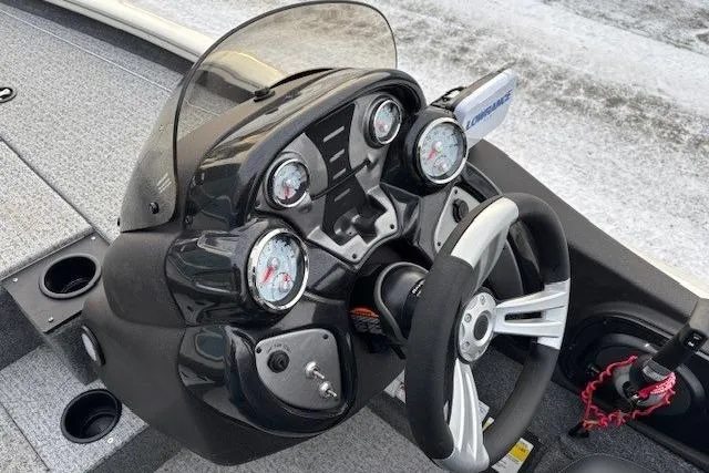Slide: The Image of 2023 Tracker Pro Team 195 TXW Tournament Edition boat dashboard with gauges and steering wheel. - 18