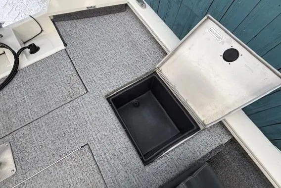 Slide: The Image of 2023 Tracker Pro Team 195 TXW Tournament Edition boat storage compartment open. - 25