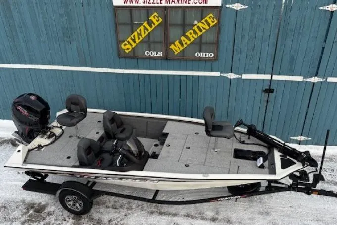 Slide: The Image of 2023 Tracker Pro Team 195 TXW Tournament Edition boat on trailer, parked outside Sizzle Marine. - 5