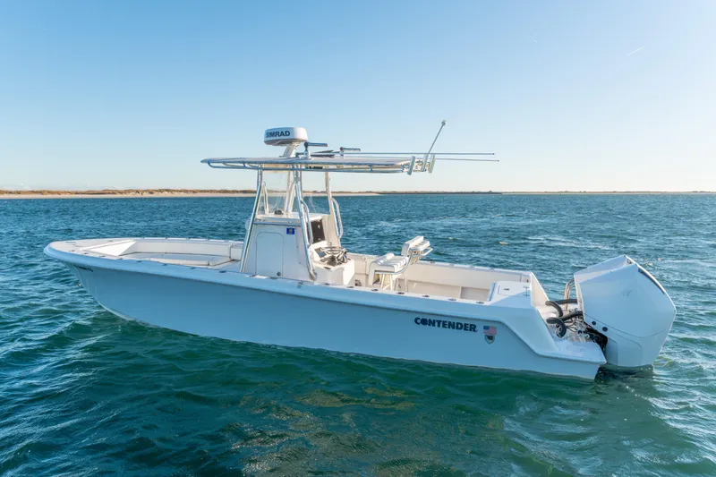 The Image of 2023 Contender 28 Sport boat on open water, clear sky background. - 0