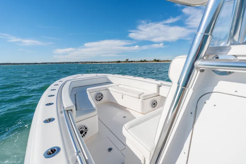 Slide: The Image of 2023 Contender 28 Sport boat on open water, featuring sleek design and comfortable seating. - 5