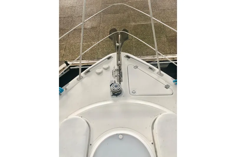 Slide: The Image of Bow view of 2005 Carver 444 Cockpit Motor Yacht, showcasing deck and anchor system. - 31