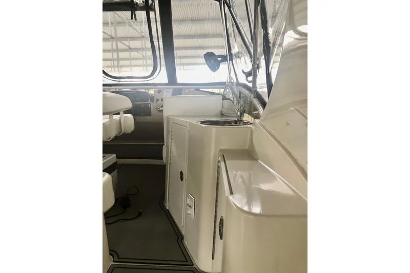 Slide: The Image of 2005 Carver 444 Cockpit Motor Yacht interior with seating and control panel. - 36