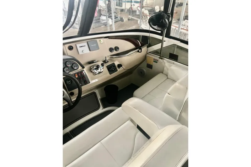 Slide: The Image of 2005 Carver 444 Cockpit Motor Yacht interior with helm, seating, and navigation equipment. - 39