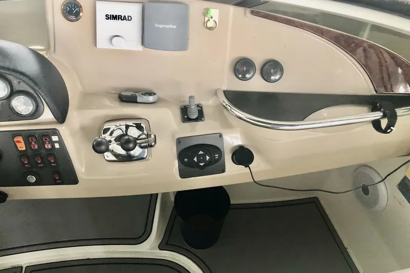 Slide: The Image of Control panel of 2005 Carver 444 Cockpit Motor Yacht with navigation instruments. - 44