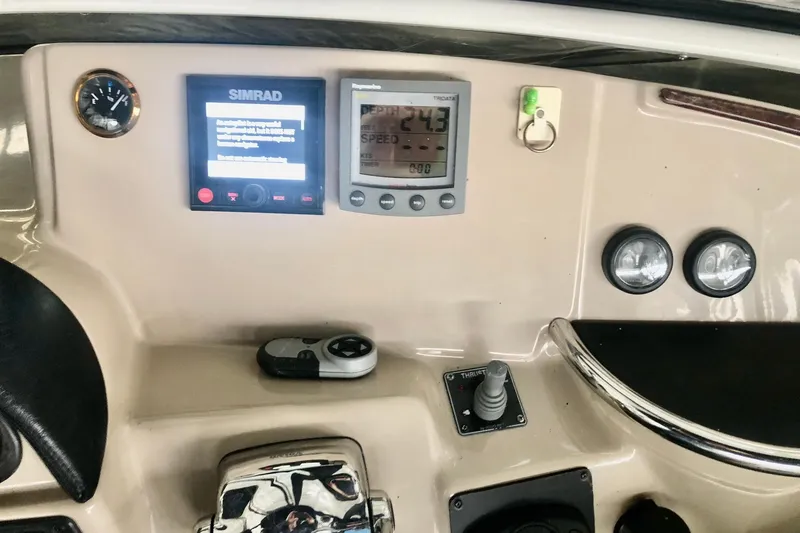 Slide: The Image of Dashboard of a 2005 Carver 444 Cockpit Motor Yacht with navigation instruments. - 45