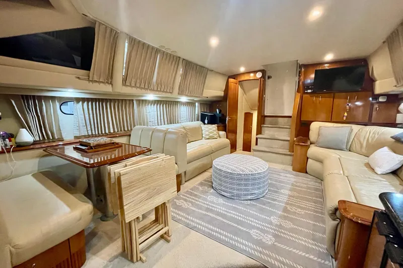Slide: The Image of Luxurious interior of 2005 Carver 444 Cockpit Motor Yacht with plush seating and elegant decor. - 50