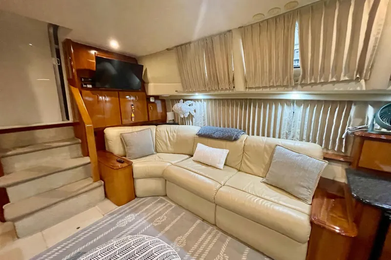 Slide: The Image of Luxurious interior of 2005 Carver 444 Cockpit Motor Yacht with plush seating and elegant decor. - 54