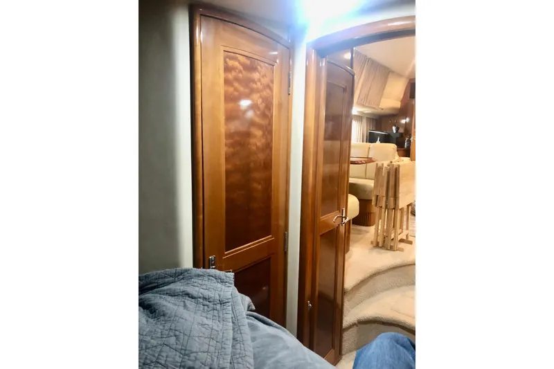 Slide: The Image of Interior of 2005 Carver 444 Cockpit Motor Yacht with wooden doors and cozy seating area. - 64