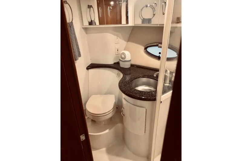 Slide: The Image of Bathroom interior of 2005 Carver 444 Cockpit Motor Yacht with sink and toilet. - 73