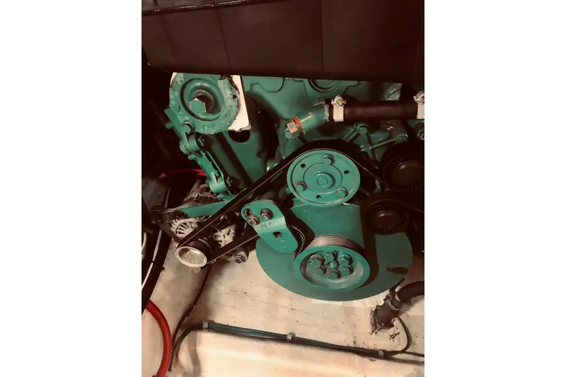 Slide: The Image of Engine components of a 2005 Carver 444 Cockpit Motor Yacht, featuring belts and pulleys. - 78
