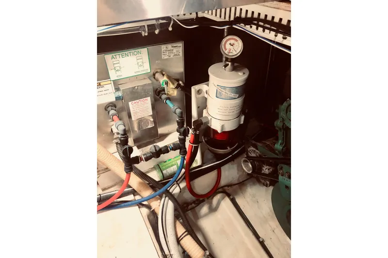 Slide: The Image of Engine room of 2005 Carver 444 Cockpit Motor Yacht with fuel system components. - 79