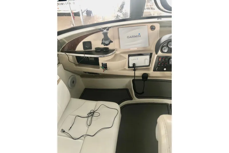 Slide: The Image of 2005 Carver 444 Cockpit Motor Yacht helm with Garmin navigation system and control panel. - 38
