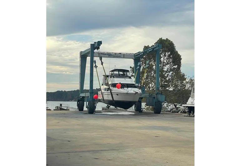Slide: The Image of 2005 Carver 444 Cockpit Motor Yacht on a boat lift. - 4