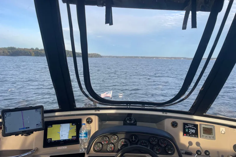 Slide: The Image of Cockpit view from 2005 Carver 444 Cockpit Motor Yacht on open water. - 42