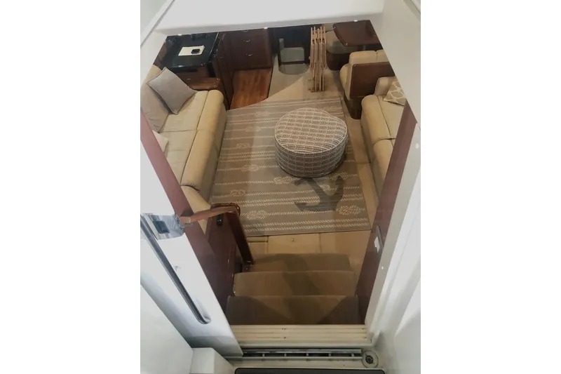 Slide: The Image of Interior of 2005 Carver 444 Cockpit Motor Yacht with cozy seating and stylish decor. - 48